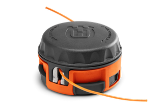 Front view of a Husqvarna trimmer head with visible trimmer line.