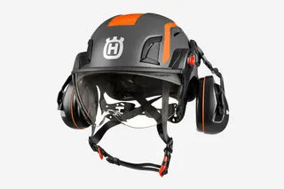 Front view of a Husqvarna safety helmet with ear protection and visor.