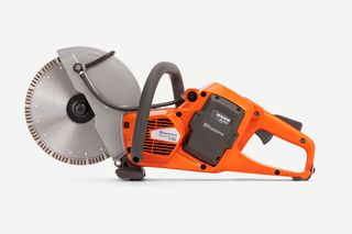 Side view of a Husqvarna power cutter with ergonomic handle.