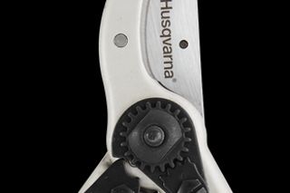 Front view of Husqvarna pruning shears with ergonomic handles.