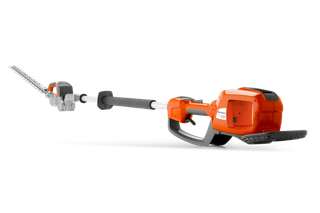 Side view of a Husqvarna battery-powered hedge trimmer with extended reach.