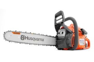 Side view of a Husqvarna chainsaw with X-Force bar and chain.