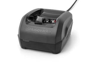 Front view of a Husqvarna battery charger with visible connection ports.
