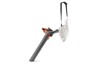 Side view of a leaf blower with an attached collection bag.