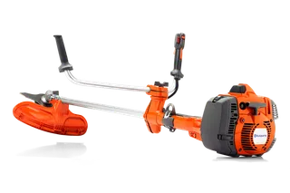 Side view of a Husqvarna brush cutter with ergonomic handles and protective guard.