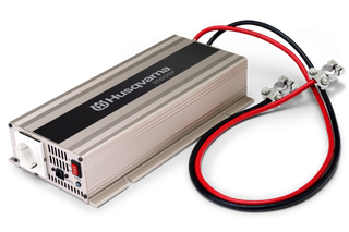 Husqvarna power inverter with attached cables, designed for electrical applications.