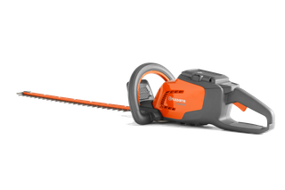 Side view of a Husqvarna hedge trimmer with ergonomic handle and battery compartment.