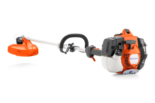 Side view of a Husqvarna brush cutter showcasing its engine and cutting head.