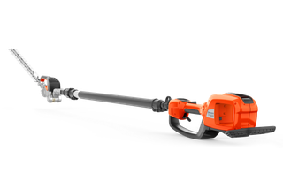Side view of a Husqvarna battery-powered hedge trimmer with an extended reach.