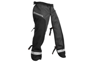 Front view of Husqvarna chainsaw protective trousers with reflective bands.