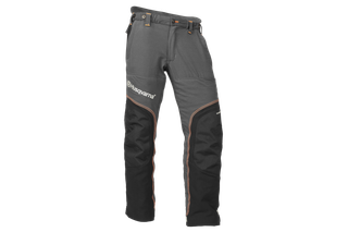 Front view of Husqvarna chainsaw trousers with reinforced knee and thigh areas.