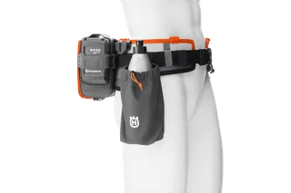 Side view of a Husqvarna battery belt with a battery pack and a utility pouch.