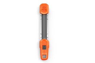 Top view of a tool with a rectangular shape and orange ends, possibly a sharpening guide.
