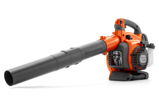Side view of a Husqvarna leaf blower with ergonomic handle and air intake visible.