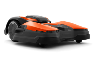 Side view of a Husqvarna robotic lawn mower designed for efficient garden maintenance.