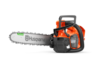 Side view of a Husqvarna chainsaw with visible branding and chain.