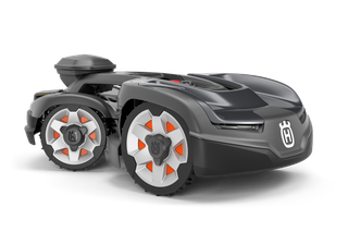 Side view of a Husqvarna robotic lawn mower with visible wheels and logo.