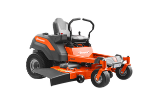 Side view of a Husqvarna zero-turn ride-on mower with visible cutting deck.