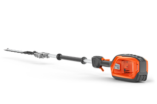Side view of a Husqvarna battery-powered hedge trimmer with an extended reach.