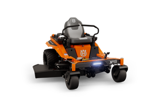 Front view of a Husqvarna zero-turn mower with visible seat and steering controls.