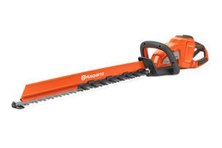 Side view of a Husqvarna hedge trimmer with a long cutting blade.