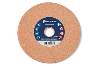 Front view of a Husqvarna abrasive cutting disc with safety icons and specifications.