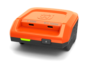 Front view of a Husqvarna dual-port battery charger with 45W and 100W outputs.