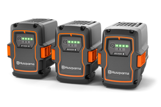 Front view of three Husqvarna batteries with LED indicators, models B140X, B220X, and B330X.