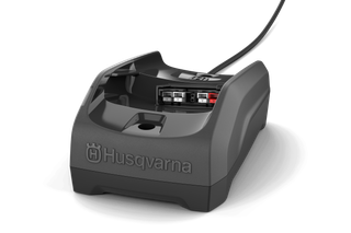 Front view of a Husqvarna battery charger with visible charging slots.